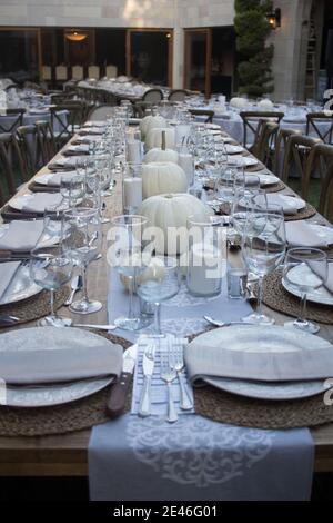 Elegant dinner table served on a garden Stock Photo