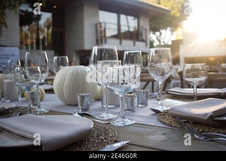 Elegant dinner table served on a garden Stock Photo