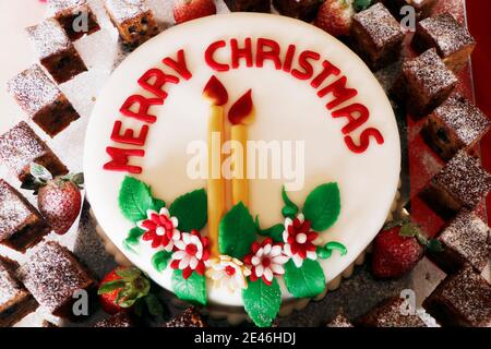 christmas festive decorated icing cake (plum cake) in close up Stock Photo