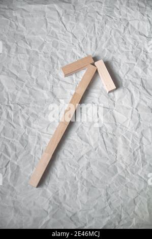 background of crumpled craft paper with wooden rectangles arranged in a certain order in a minimalist style Stock Photo
