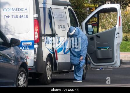 Bogota, Colombia. January 21, 2021: A nurse wearing a biosecurity gown in front of a clinic north of Bogota. This Friday the city at 8 pm will again be in total quarantine all weekend until Monday at 4 am. Credit: Daniel Garzon Herazo/ZUMA Wire/Alamy Live News Stock Photo