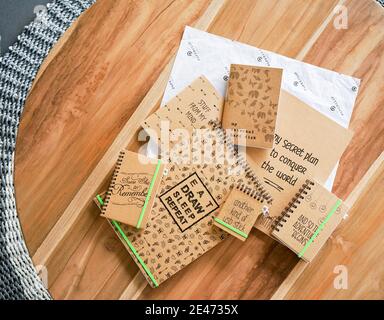 Lots of notebooks on wooden table and top view Stock Photo