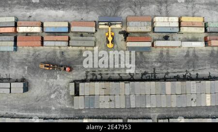 (210122) -- JINAN, Jan. 22, 2021 (Xinhua) -- Aerial photo taken on Jan. 21, 2021 shows staff members of the China Railway Jinan Group Co., Ltd. moving cargo for trains to Europe and other parts of Asia in Dongjiazhen Township of Jinan City, capital of east China's Shandong Province. The China Railway Jinan Group Co., Ltd. has been boosting the business of its 'Qilu' freight trains to Europe and other parts of Asia by steadily streamlining cargo flows in recent years. A total of 1,506 'Qilu' trains left Shandong in 2020, a year-on-year growth of 42.9 percent. These trains have served as 'accele Stock Photo