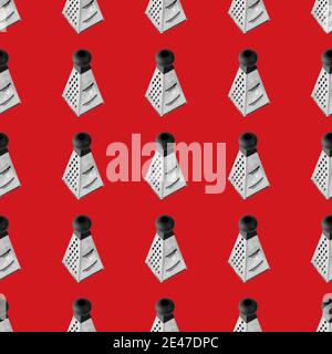Seamless pattern from Metal grater. Isolated on red background flat lay. Stock Photo