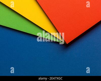 Colorful paper design with red, yellow and green on a blue background Stock Photo
