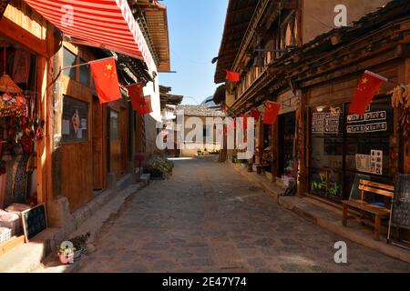 Inside Dukezong, the rebuilt old part of Shangri La in Yunnan province. Wooden buildings and cobbled streets in Tibetan style. Stock Photo