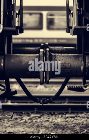 Vertical closeup shot of an old steam locomotive two wagon connection details Stock Photo