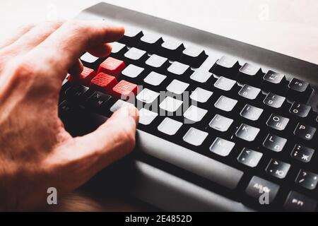 Male hand on the keys awsd control during the game - cyber sport Stock Photo