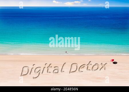 The Words Digital Detox written on a Sunny Beach Stock Photo