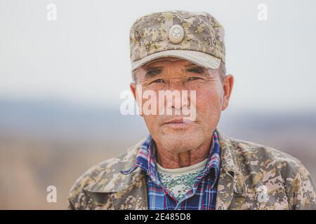 Almaty Province, Kazakhstan - September 23 2017: Portrait of an elderly Kazakh man park ranger in Charyn Canyon National Park, Kazakhstan. Stock Photo