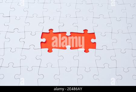 Empty white jigsaw puzzle with  missing pieces Stock Photo