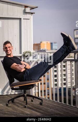 Man coach is working home with his clients through online platfoms Stock Photo