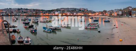 ST IVES, CORNWALL, UK - JUNE 09, 2009:  View of the harbour and town at dusk Stock Photo