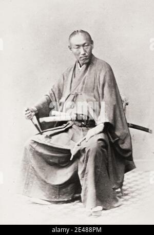 Vintage 19th century photograph: samurai with two swords, image probably the work of the Shimooka Renjo studio. Stock Photo