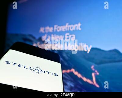 Mobile phone with logo of automotive company Stellantis N.V. on screen in front of company website. Focus on center of smartphone screen. Stock Photo