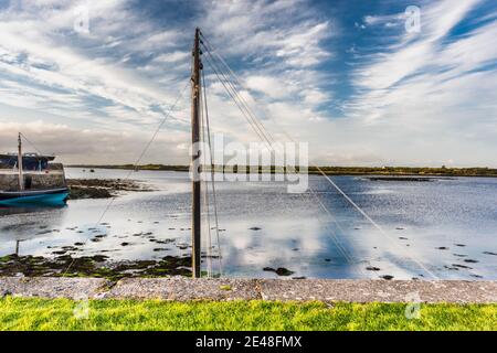 A peaceful summer evening on the quayside at Kinvara Bay, Kinvara, County Galway, Ireland Stock Photo