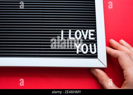 I love you in white letters on a framed blackboard. Whiteboard for entries and tags. Valentine's Day, a declaration of love, a letter, a postcard. Cop Stock Photo
