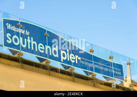 Welcome to Southend Pier sign. The longest pleasure pier in the world, slogan, behind glass panelled barrier Stock Photo