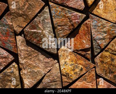 Brown red monochrome surface of granite wall close-up. Natural decorative stone background Stock Photo
