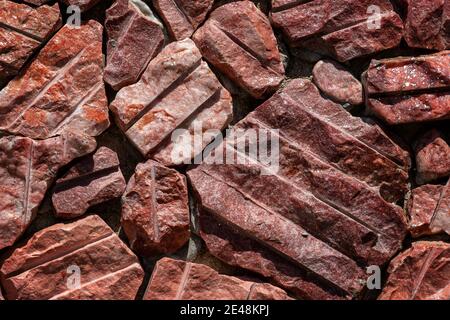 Brown red monochrome surface of granite wall close-up. Natural decorative stone background Stock Photo