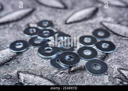 Stainless steel grower washers, Metal fasteners, Many washers for construction as an industrial style background , close-up Stock Photo