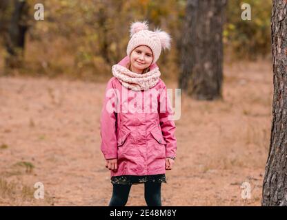 Little girl in knitted scarf and hat Stock Photo