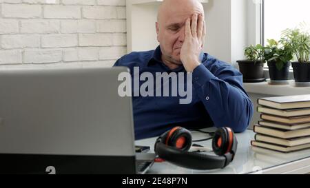 Man Working from Home Talking in a Video Call Using Laptop Connection Stock Photo
