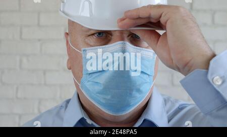 Confident Image with an Engineer Wearing Face Protection Mask Against Viruses Stock Photo