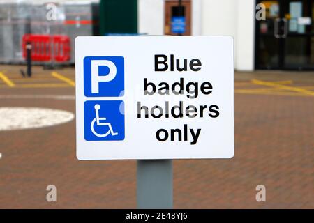 Car parking sign for Blue Badge Holders Only in the parking area for Cromer Hospital in North Norfolk at Cromer, Norfolk, England, United Kingdom. Stock Photo