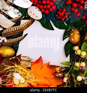 Happy Easter. Congratulatory easter background. Easter eggs and flowers. Flat lay. Nature concept. Stock Photo