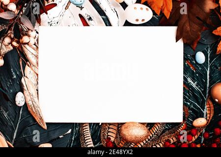 Happy Easter. Congratulatory easter background. Easter eggs and flowers. Flat lay. Nature concept. Stock Photo