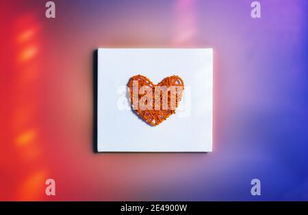 Felt red heart isolated on a white background . Red toys in the form of hearts on a light Stock Photo