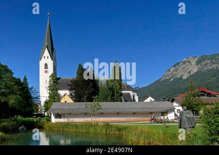 Kurpark and Catholic Church of St. Johannes Baptist Oberstdorf, Allgäu, Swabia, Bavaria, Germany Stock Photo