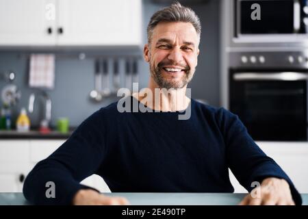 Happy Man Video Conference Webinar Portrait At Home Stock Photo