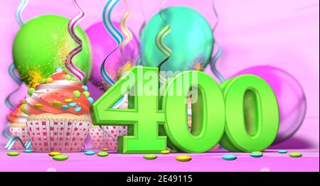 Birthday cupcake with sparking candle with the number 400 large in green with cupcakes with red cream decorated with chocolate chips and balloons on t Stock Photo