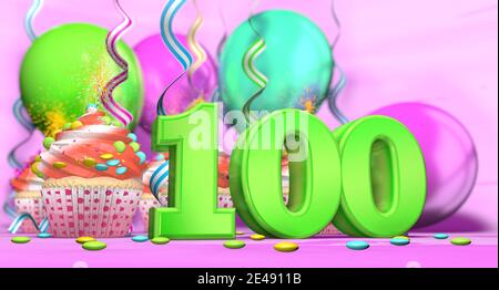 Birthday cupcake with sparking candle with the number 100 large in green with cupcakes with red cream decorated with chocolate chips and balloons on t Stock Photo