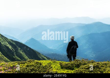 Man silhouette on foggy mountains. Travel concept. Landscape photography Stock Photo
