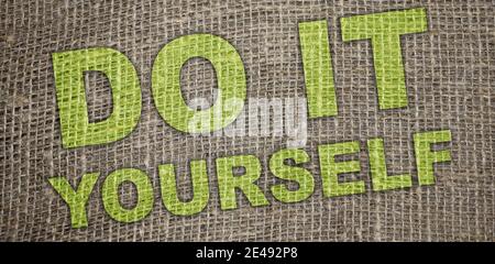 Do it Yourself words printed on burlap canvas. business startup concept.. Stock Photo