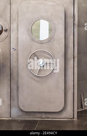 Closed the heavy steel sealed door to the underground bunker. Stock Photo