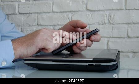 Businessman Working from Home Use Mobile and Internet Connection Accessing from Distance Company Office Network information Stock Photo