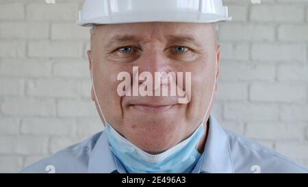 Confident Image with an Engineer Wearing Face Protection Mask Against Viruses. Stock Photo