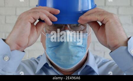 Confident Image with an Engineer Wearing Face Protection Mask Against Viruses. Stock Photo
