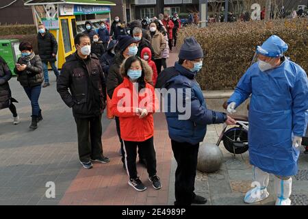 People line up to get their nucleic acid test following the outbreak of the coronavirus disease (COVID-19) in Beijing, China January 22, 2021. Stock Photo