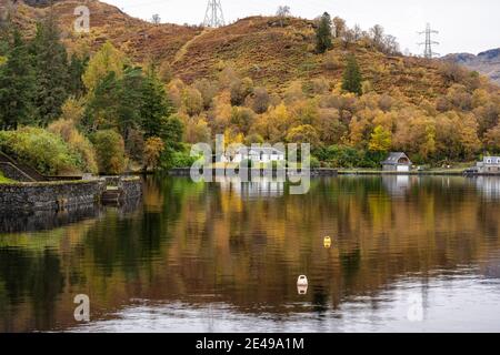 Autumn reflections Stronachlachar Village on Loch Katrine, Scotland, UK