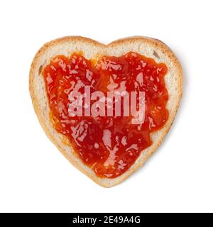 Heart shaped slice of bread with jam of rose hips isolated on white background Stock Photo