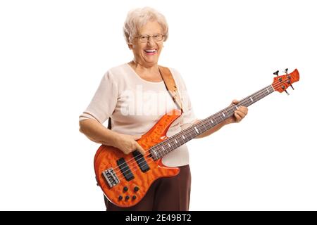 Elderly woman with an electric bass guitar smiling at the camera isolated on white background Stock Photo
