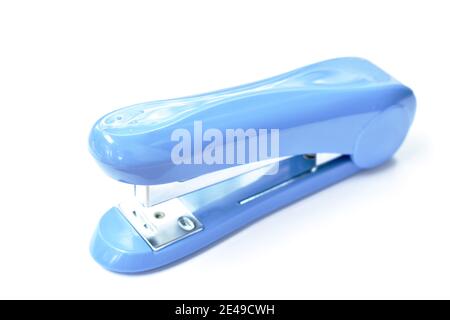 big blue stapler for pushing paper on white background Stock Photo