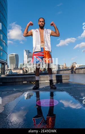 London, UK.  22 January 2021. A boxer named B from Ilford, a former mixed martial arts (MMA) fighter, practices a few moves in the sunshine near the City of London.  Credit: Stephen Chung / Alamy Live News Stock Photo