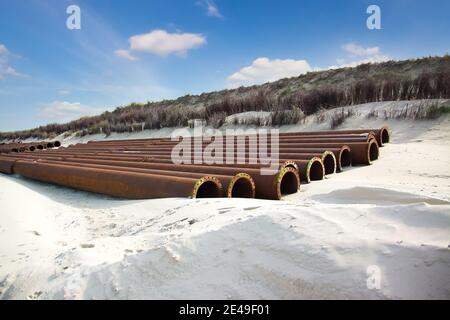 Pipelines for sand replenishment for the coast protection on Langeoog, ostfriesische Insel, Germany. Stock Photo