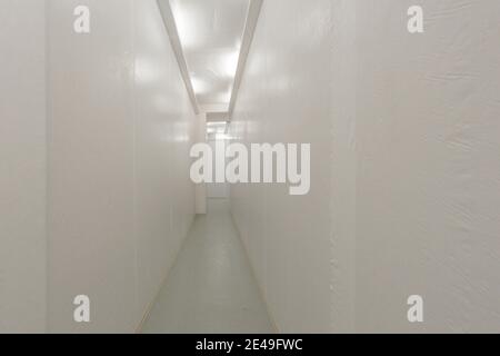 Long white corridor with white walls Stock Photo